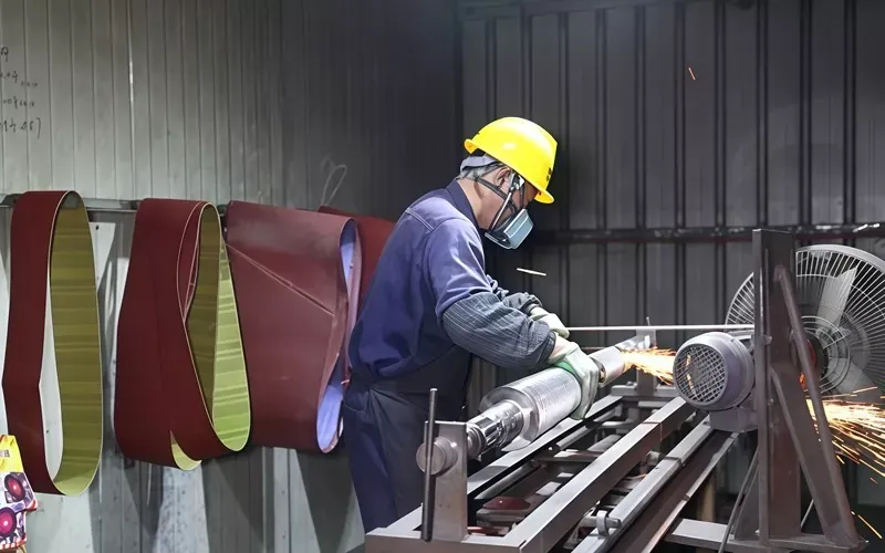 Precision grinding of industrial roller components