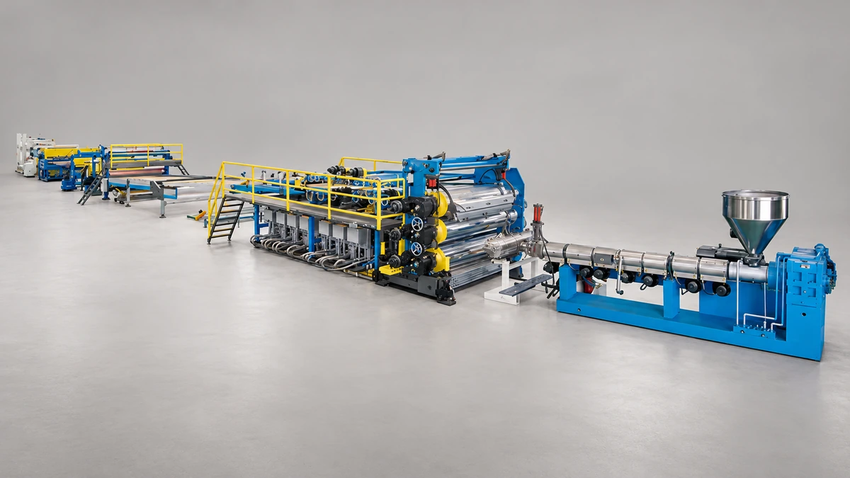 Blue extrusion line with large feed hopper, barrel sections and yellow-railed roller stages