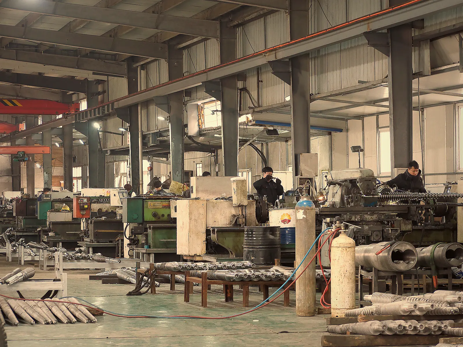 Skilled workers operating precision lathes