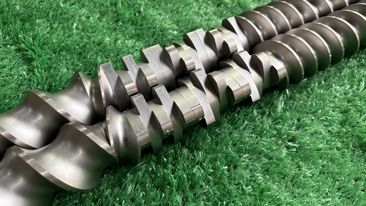 Close-up of kneading and conveying elements assembled on two modular extruder screws.