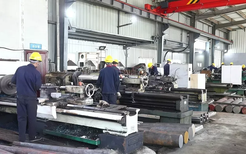 Skilled workers operating precision lathes