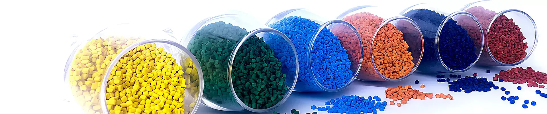 Colored plastic pellets in glass containers